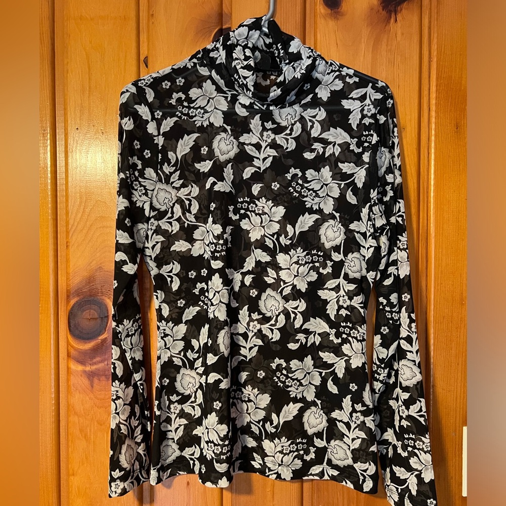NWOT! Never worn. Flattering lightweight floral blouse.